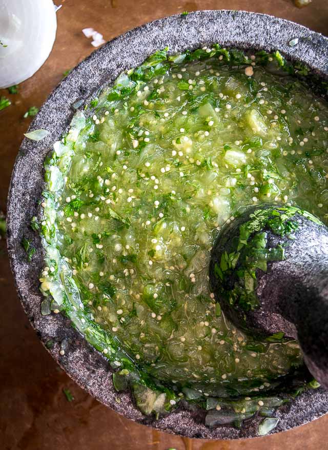 The flavor you can generate by smooshing ingredients in a molcajete is unreal. You'll end up with a vibrant batch of Salsa Verde that could potentially cause you to break up with the other salsas in your life. mexicanplease.com 