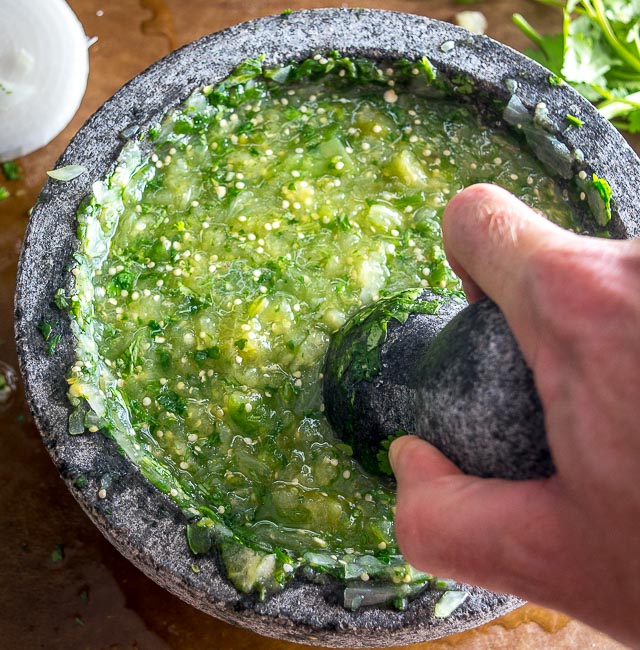 The flavor you can generate by smooshing ingredients in a molcajete is unreal. You'll end up with a vibrant batch of Salsa Verde that could potentially cause you to break up with the other salsas in your life. mexicanplease.com 