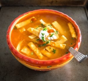 Here's an authentic Chicken Tortilla Soup recipe that relies on just a few key ingredients to create some real flavor! Includes directions for frying up a quick batch of tortilla strips. mexicanplease.com