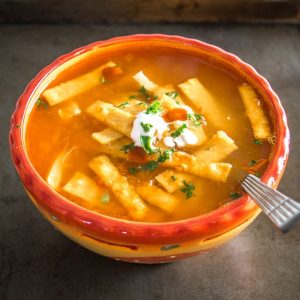 Here's an authentic Chicken Tortilla Soup recipe that relies on just a few key ingredients to create some real flavor! Includes directions for frying up a quick batch of tortilla strips. mexicanplease.com