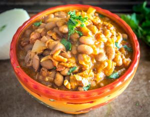 Charro Beans! You won't find a heartier, more delicious batch of beans anywhere in Mexico. This version uses bacon and chipotles but feel free to add in some chorizo if you have it. So good! mexicanplease.com