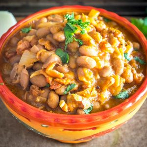 Charro Beans! You won't find a heartier, more delicious batch of beans anywhere in Mexico. This version uses bacon and chipotles but feel free to add in some chorizo if you have it. So good! mexicanplease.com