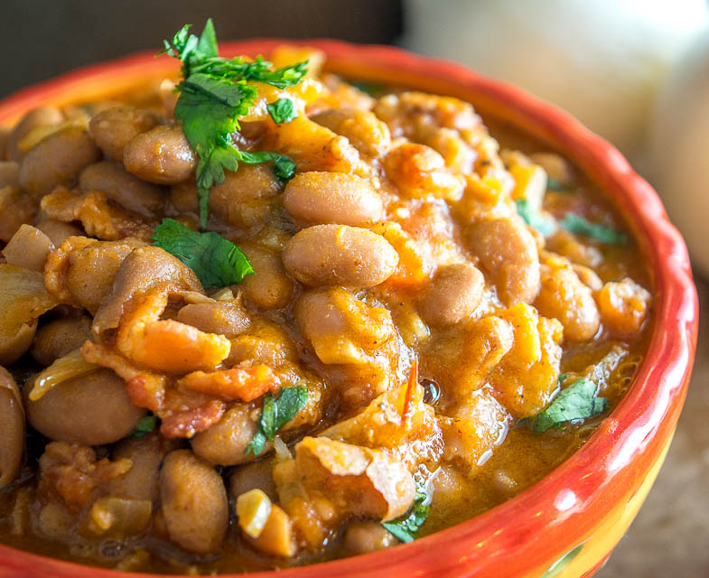 Charro Beans! You won't find a heartier, more delicious batch of beans anywhere in Mexico. This version uses bacon and chipotles but feel free to add in some chorizo if you have it. So good! mexicanplease.com