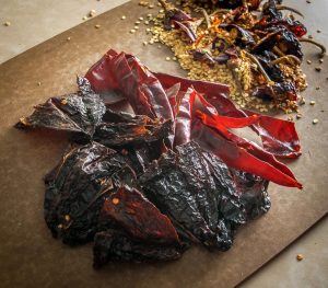 Ancho and Guajillo chili peppers turn this authentic adobo sauce into a flavorbomb! Use it to season meats or liquefy it for all sorts of stews -- so good! mexicanplease.com