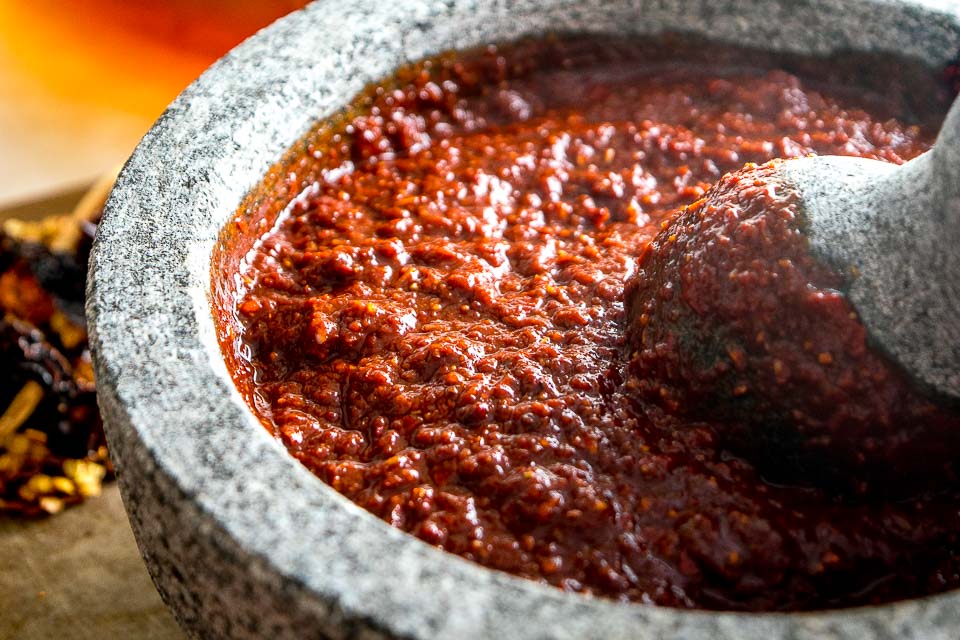 Ancho and Guajillo chili peppers turn this authentic adobo sauce into a flavorbomb! Use it to season meats or liquefy it for all sorts of stews -- so good! mexicanplease.com 