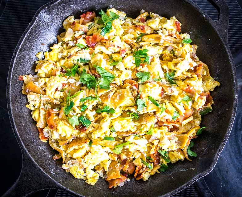 Migas are the perfect Mexican breakfast dish for lazy weekend mornings. We're topping this version with a freshly made Salsa Verde and it is delicious! mexicanplease.com 