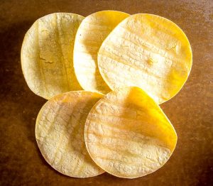 This is the easiest way to make an awesome batch of Baked Tortilla Chips. I like them best when the edges are crispy but the middle is still slightly chewy, i.e. don't cook them too long! mexicanplease.com