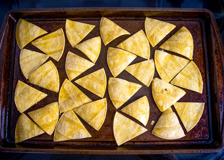 This is the easiest way to make a batch of Baked Tortilla Chips. I like them best when the edges are crispy but the middle is still slightly chewy, i.e. don't cook them too long! mexicanplease.com