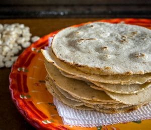 Here's the recipe for a recent batch of homemade corn tortillas I made using some White Olotillo Corn. I used a food processor to grind the corn down and added in some Masa Harina to get the right consistency. mexicanplease.com