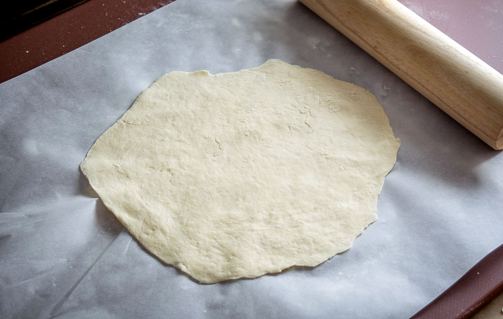 This is my new favorite pizza! The pickled tomatillos pair well with the chorizo and we're using a garlic oil layer as the sauce -- so good! mexicanplease.com