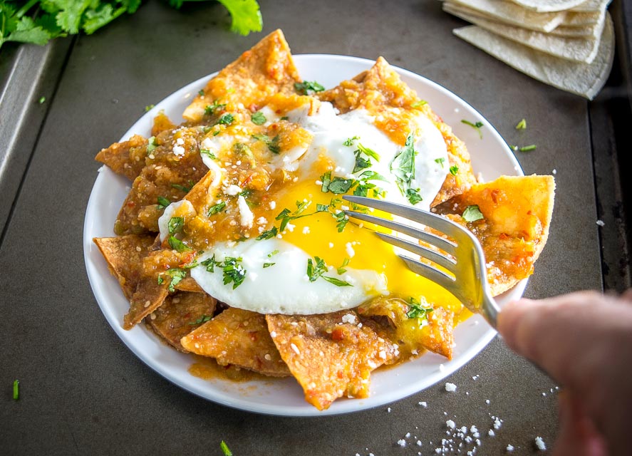 chilaquiles served with egg on a plate