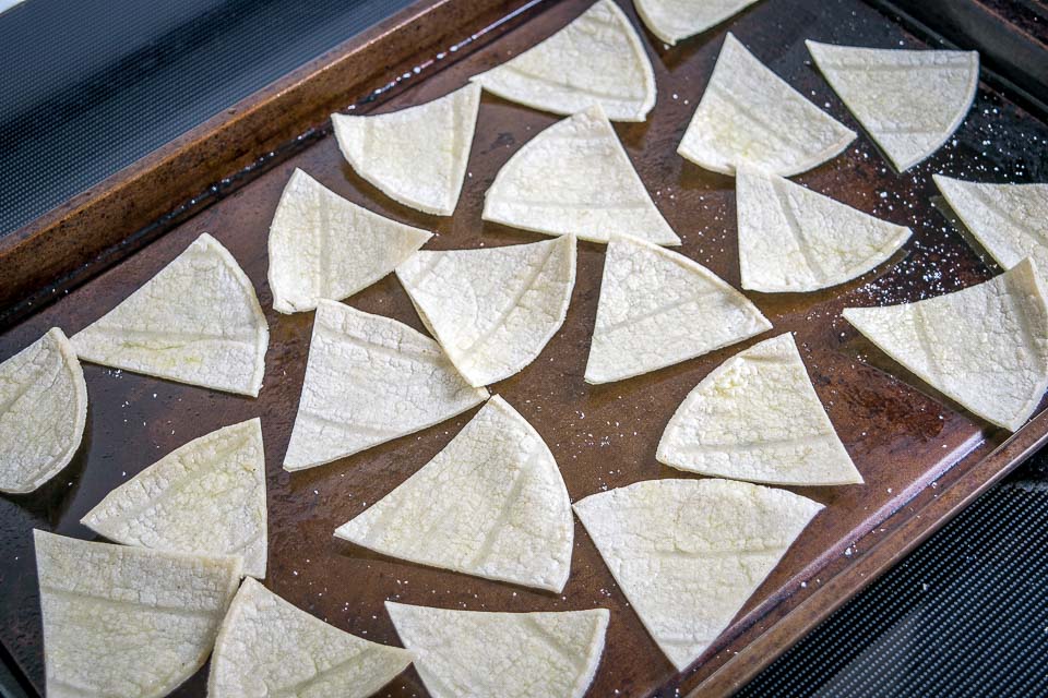 corn tortilla pieces on sheet pan