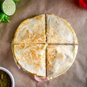 As promised, here are the quesadillas I've been making with my leftover Chili Verde. I used some homemade pickled onions for this batch and they are delicious! mexicanplease.com