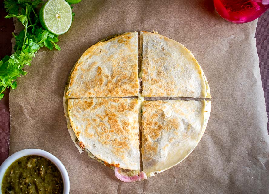 As promised, here are the quesadillas I've been making with my leftover Chili Verde. I used some homemade pickled onions for this batch and they are delicious! mexicanplease.com