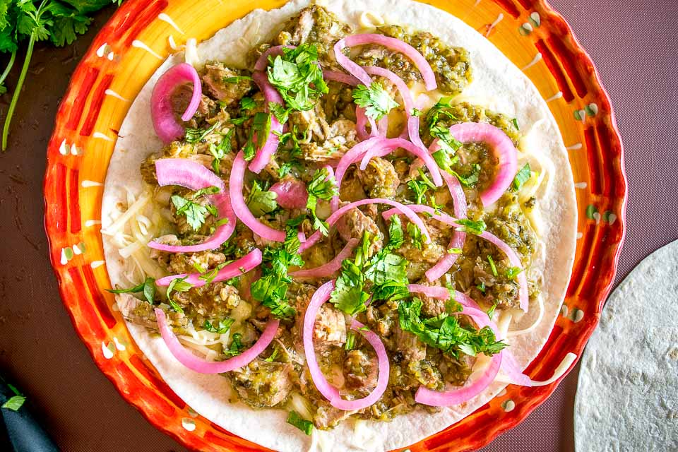 As promised, here are the quesadillas I've been making with my leftover Chili Verde. I used some homemade pickled onions for this batch and they are delicious! mexicanplease.com