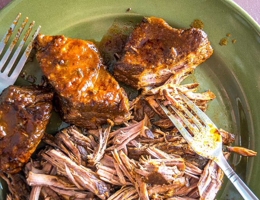 Testing brisket for fork tenderness.