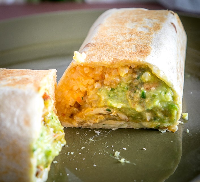 Put some Avocado Salsa Verde in your burritos and everything beyond that is a bonus! I added chicken, Mexican rice, and cheese to this batch -- yum!! mexicanplease.com