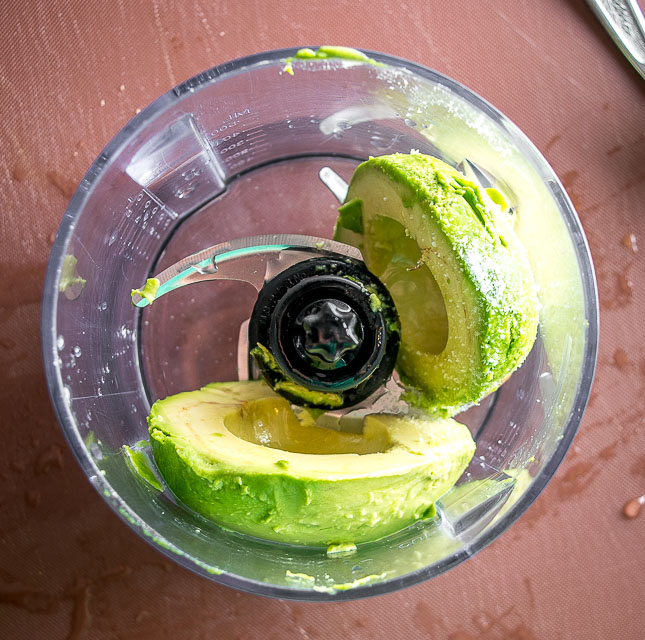 Adding salt to avocado in blender