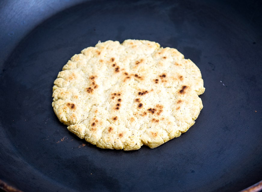 Cooking each side of the Gordita for 4-5 minutes.