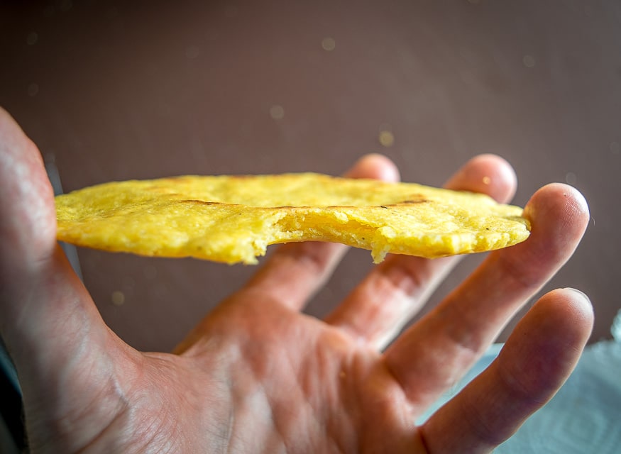 Taking a bite out of Gordita cooked in oil. 