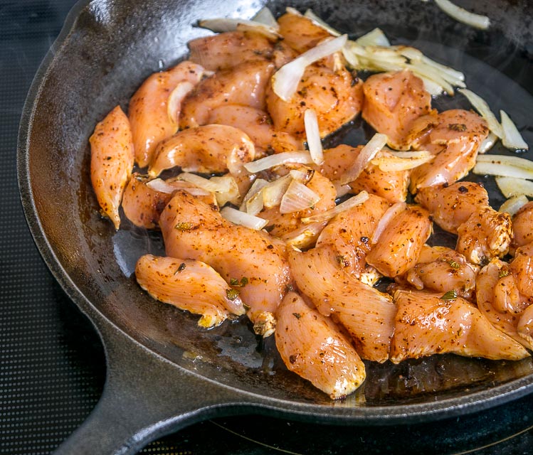 Forming single layer with chicken pieces.