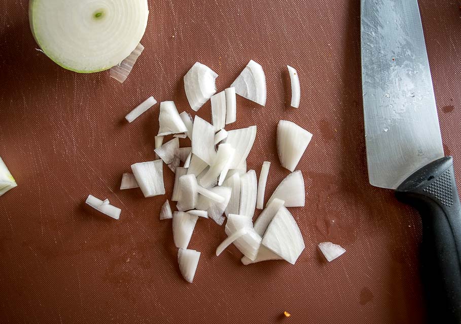 Chopping half an onion for the chicken. 