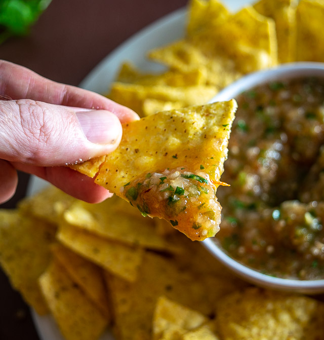 Taking a bite of freshly blended Salsa.