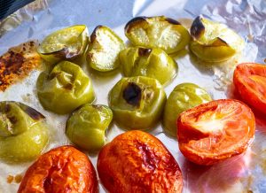 Tomatoes and tomatillos after roasting for 15 minutes