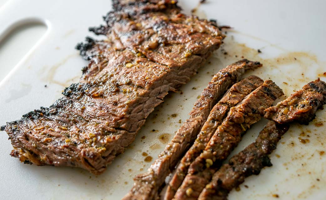 Cutting skirt steak against the grain