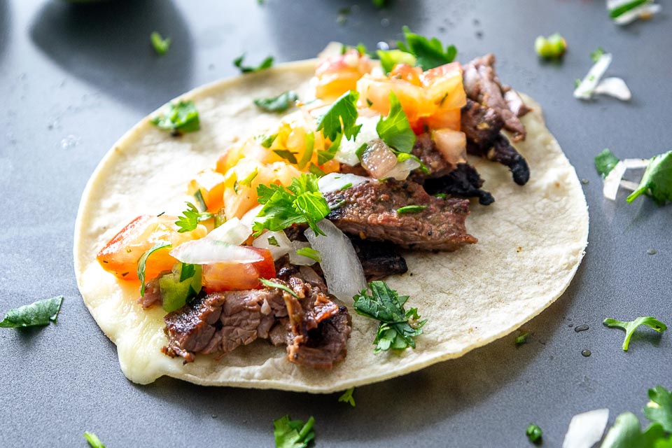 This recipe is designed to get some Carne Asada Tacos in the house -- tonight! Serve them up with some freshly chopped Pico de Gallo and you'll have some happy faces at the dinner table! mexicanplease.com