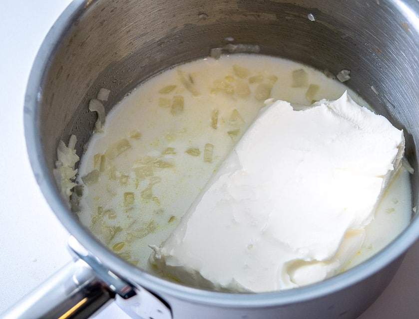 Adding cream cheese to Queso pan