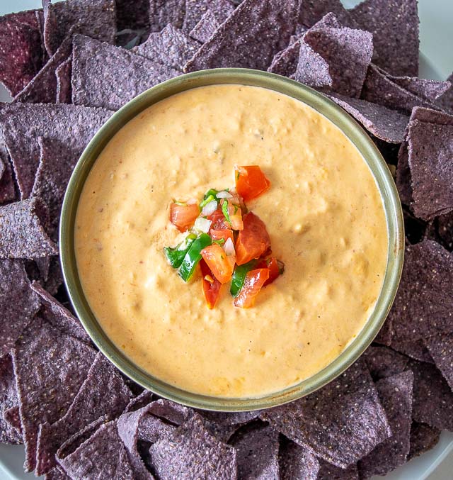 Such an easy Queso recipe! Tons of flavor from the smoky, fiery chipotles but you can always dial back on them for a milder version. mexicanplease.com