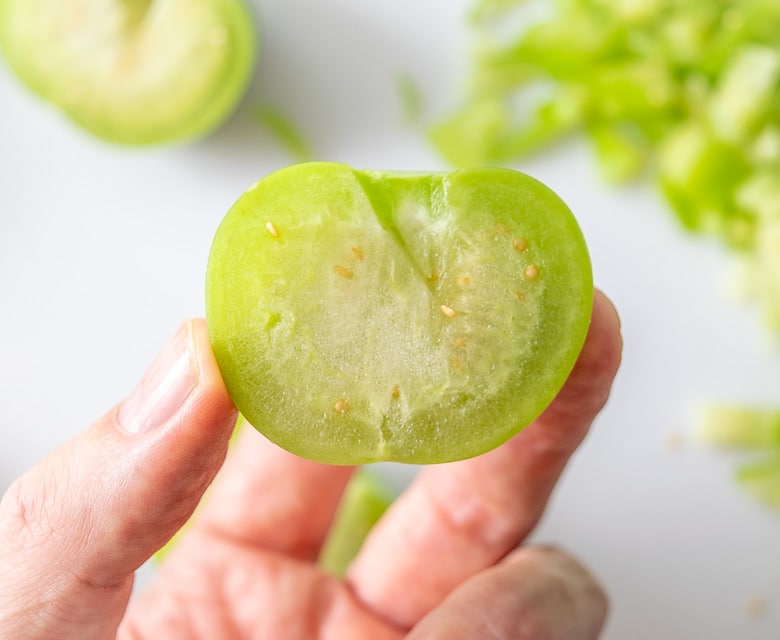 Raw tomatillo cut in half