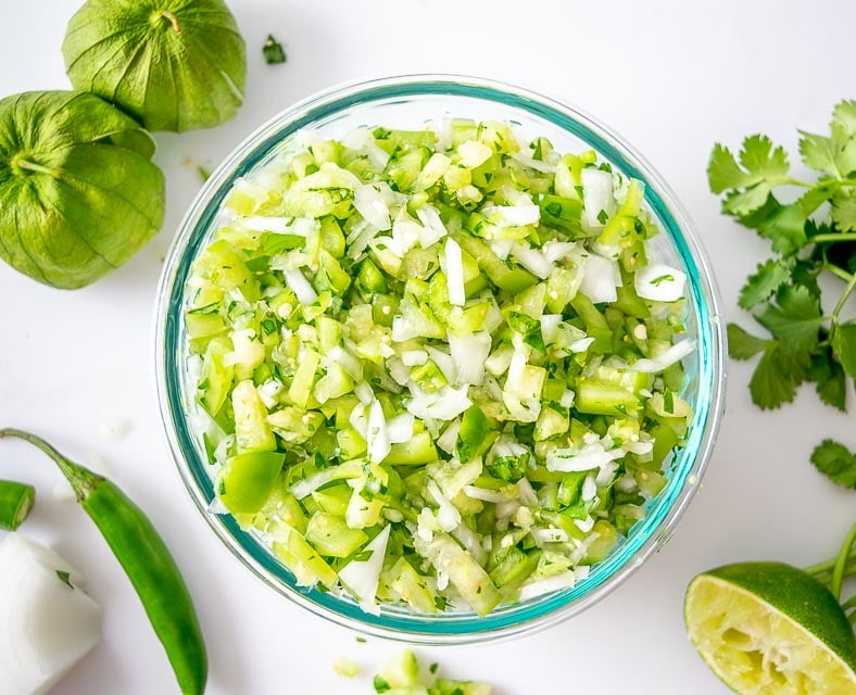 This Tomatillo Pico de Gallo wants to be in your kitchen! Lately I use it for quesadillas and it's always a hit. mexicanplease.com