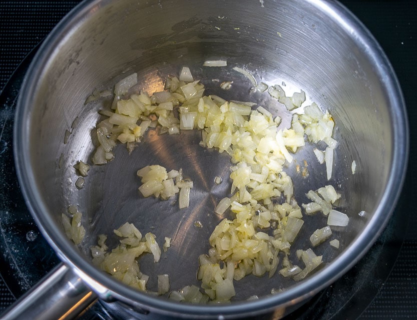 Cooking onion and garlic for Hatch enchiladas