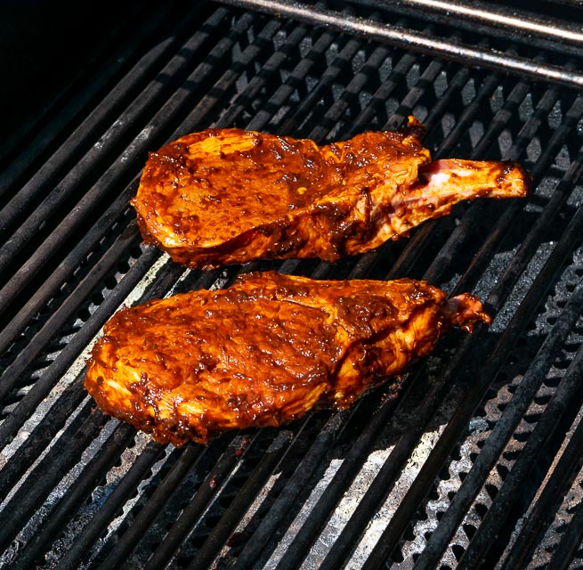 Pork chops grilling after marinating overnight