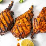 These are some delicious bone-in Pork Chops slathered with Adobo Sauce made from Ancho chiles -- so good! mexicanplease.com