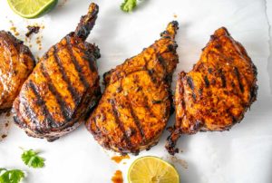 These are some delicious bone-in Pork Chops slathered with Adobo Sauce made from Ancho chiles -- so good! mexicanplease.com