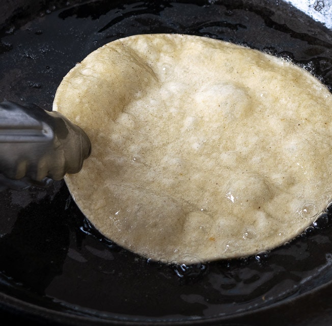 Closeup of corn tortilla frying