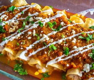 Here's an easy recipe for a wicked batch of Chicken Tinga Enchiladas -- be sure to add tomatillos to the Tinga sauce as it makes a huge difference! mexicanplease.com