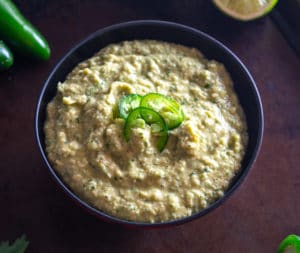 Serving jalapeno hummus in a bowl