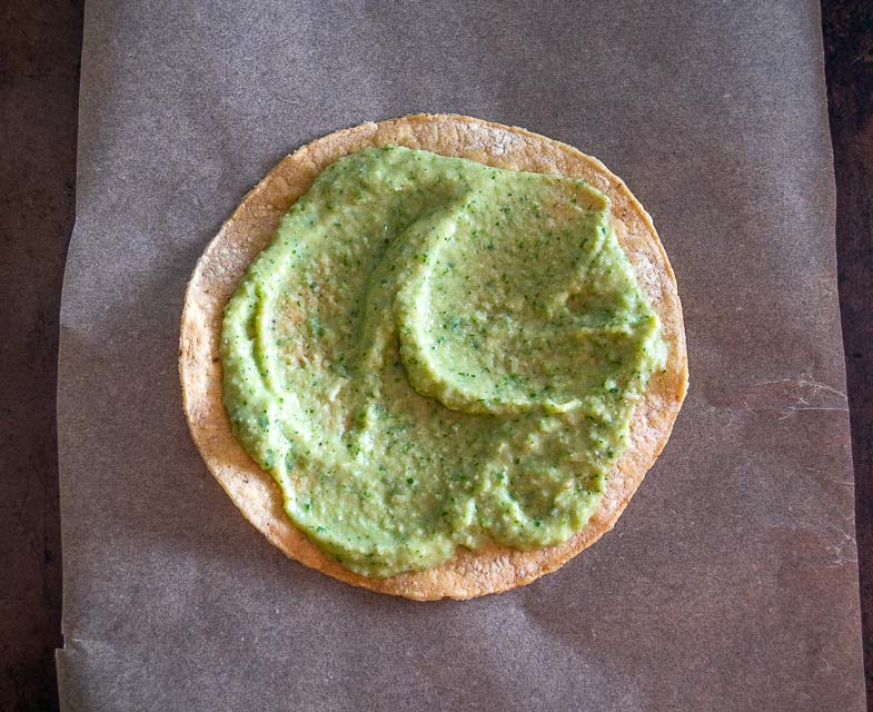 Adding Jalapeno Hummus to a tostada shell