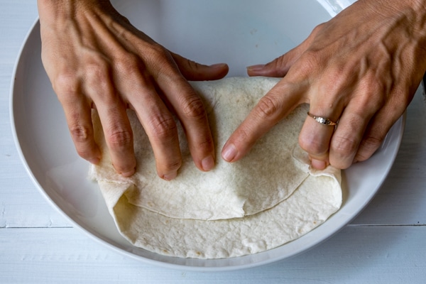 Step 5:  Tuck the tortilla in tight around the fillings and roll it up!