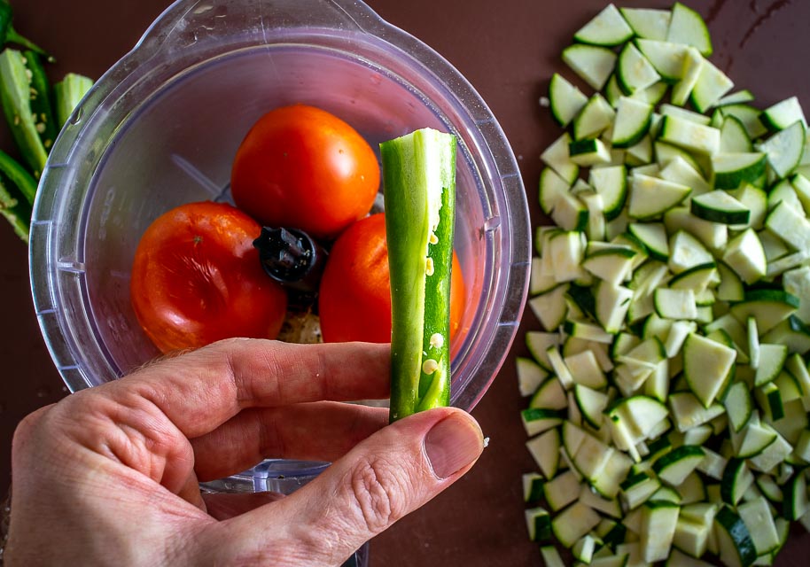 Adding one quarter jalapeno to the tomatoes