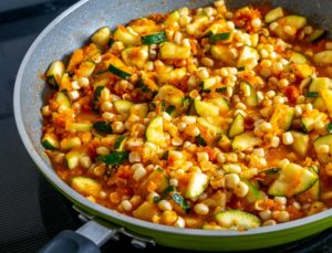 This vegetarian Calabacitas recipe is perfect for any stubborn carnivores out there! Loads of flavor made with healthy, fresh ingredients -- yum!! mexicanplease.com