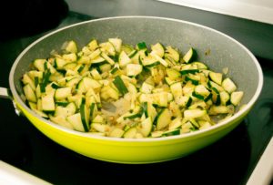 Adding zucchini to the pan