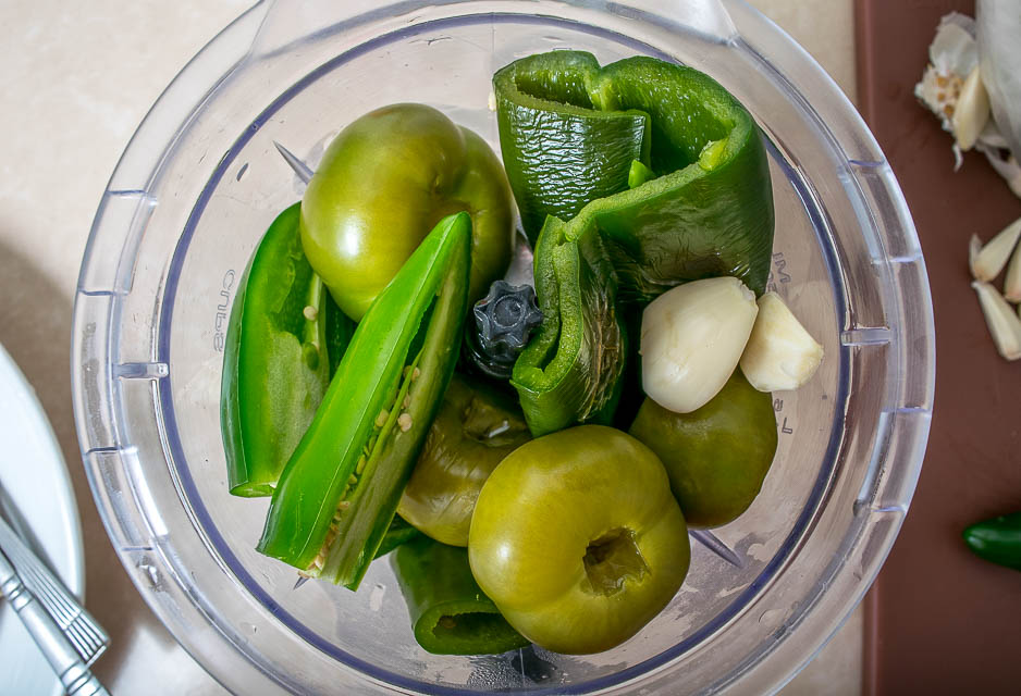 Combining chili verde ingredients in blender