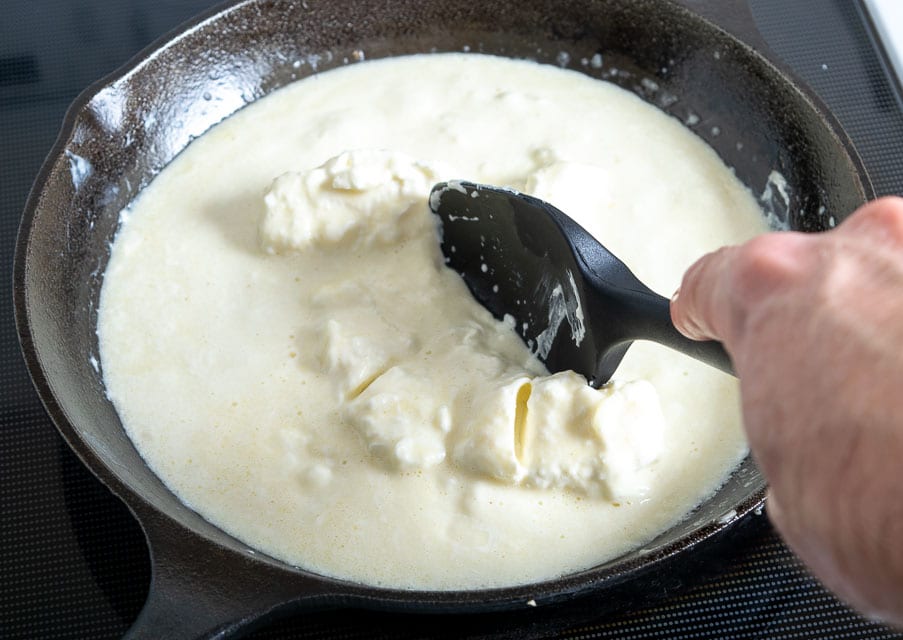 Adding cream cheese and shredded cheese