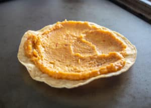 Chickpea puree on a warm tostada shell