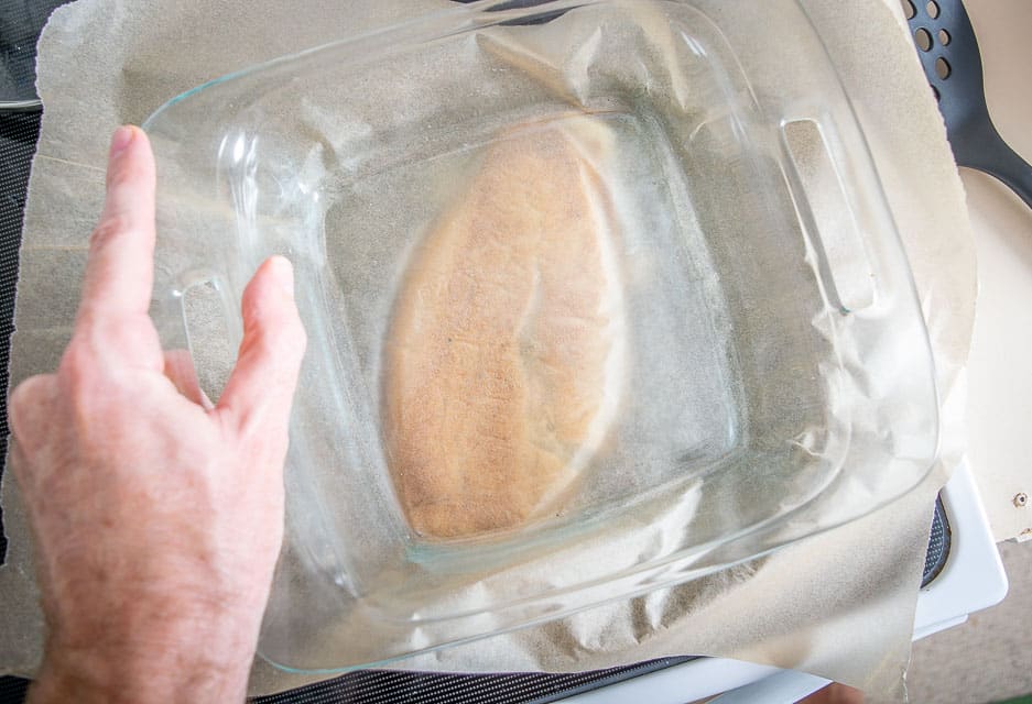 Using a casserole dish to flatten the tortas